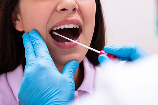 Dentist performs oral biopsy