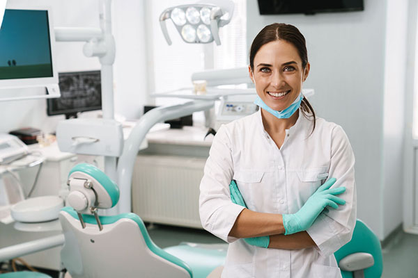 dentist smiling at their office