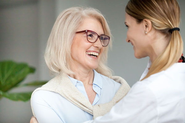 older woman smiling at daughter