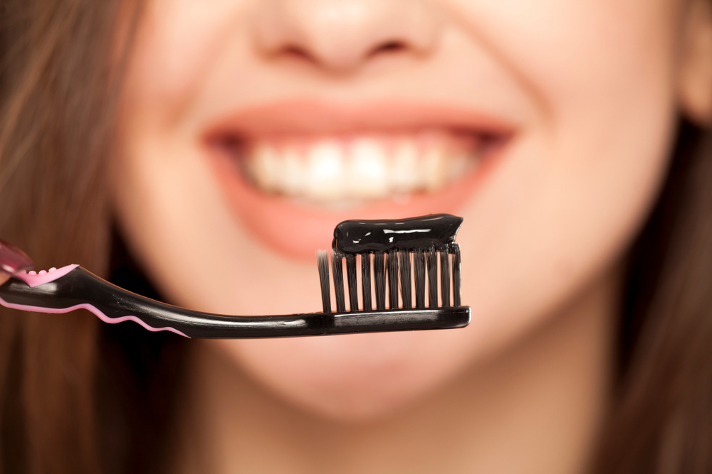 charcoal toothpaste on toothbrush
