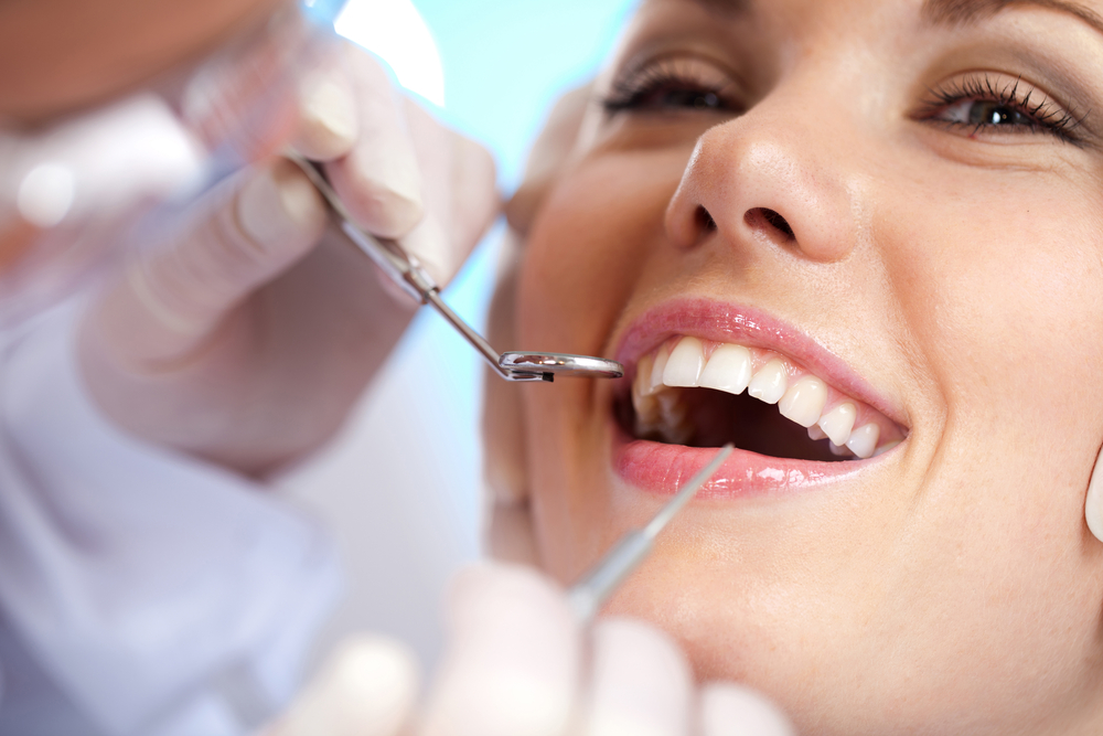 close up of a young woman mid dental exam