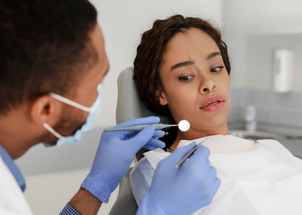 woman in dental chair has dental anxiety