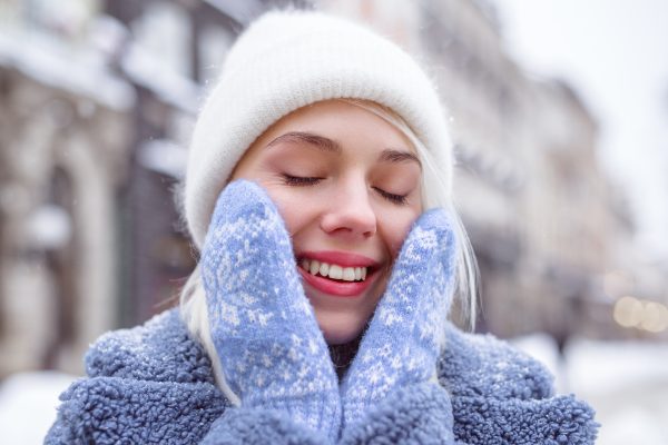 woman smiling in the snow